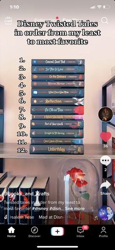 a bunch of books sitting on top of a wooden shelf in front of a computer monitor