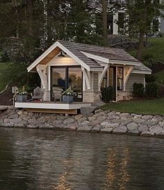 a small house sitting on top of a lake