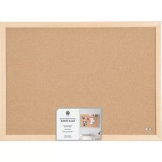 a cork bulletin board with two magnets on the front and one in the back