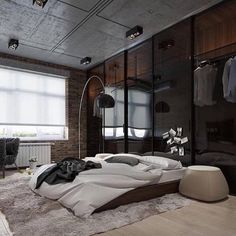 a bedroom with a large bed in the middle of it and lots of closet space