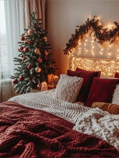 a bedroom decorated for christmas with lights on the headboard and trees in the background