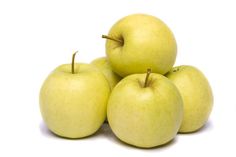 four green apples sitting on top of each other in front of a white background,