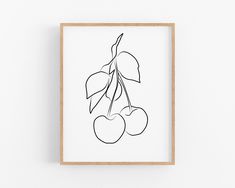 a black and white line drawing of cherries on a white background framed in a wooden frame