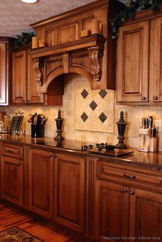 a kitchen with wooden cabinets and granite counter tops