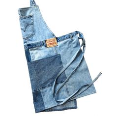 two pieces of blue jean are sitting on top of each other in front of a white background