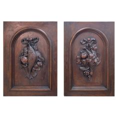 two carved wood panels depicting animals and grapes