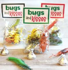 bugs and kisses candy are in bags on the table next to other candies,