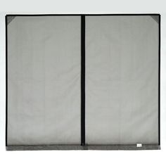 a white and black room divider with two panels on each side, one panel closed