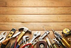 tools laid out on top of a wooden table with the words fotolia written above them