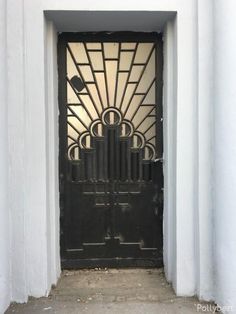 a black door with an art deco design on it