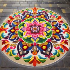 a colorfully painted circular design on the ground