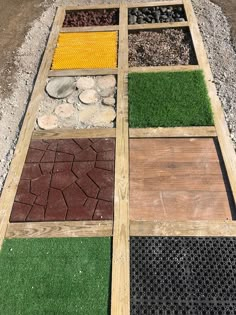 an assortment of different types of artificial grass laid out in a patch of wood on the ground