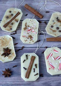 homemade christmas treats are arranged on a wooden table with cinnamon sticks and star anise