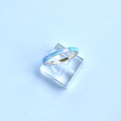 **Current processing time has been reduced to 6-8 weeks. Each ring is made to order in the order received. Thank you so much for your support and patience! 🎁 FREE Wood Ring Box with every ring purchase! 2mm wide Kyocera Solid Opal Ring shimmering with Blue and Turquoise hues. The opal is translucent and when the light hits it, the gold ring comes through in hints of pink. Wrapped around a 14K Gold filled band. Perfect for stacking with a wedding ring or stand alone for a minimalist look. Great Blue Opal Rings For Anniversary, Blue Opal Promise Ring, Blue Opal Round Ring, Blue Opal Anniversary Rings, Blue Round Opal Ring, Handmade Blue Opal Rings, Handmade Blue Opal Promise Ring, Turquoise Opal Rings Perfect For Gifts, Turquoise Opal Rings For Gift