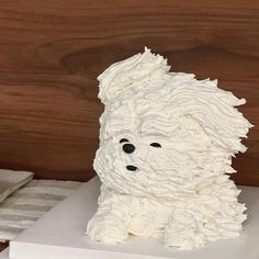 a cake shaped like a dog sitting on top of a table