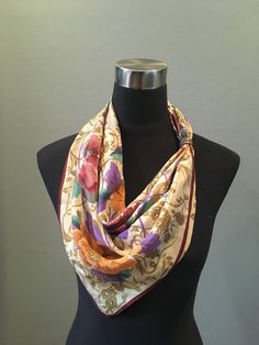 "Fabulous Oscar de la Renta scarf in gold, magenta, purple and green colorway floral pattern on a beige background with a magenta border and gold embossing. The scarf measures 31\" x 30\". Signed with the Oscar de la Renta signature. 100% silk. In very good condition. The tag is loose. FREE SHIPPING EVERYWHERE Prices are listed for Canada and USA only but if you wish to have them shipped elsewhere, please message me the shipping address and I will gladly send you a quote. We proudly reuse shippi Vintage Cream Silk Scarf, Vintage Silk Scarf With Floral Print, Vintage Multicolor Silk Scarf For Formal Occasions, Multicolor Vintage Silk Scarf For Formal Occasions, Vintage Gold Scarf For Formal Occasions, Gold Vintage Scarf For Formal Occasions, Vintage Gold Scarves For Formal Occasions, Formal Vintage Gold Scarf, Vintage Yellow Silk Scarf