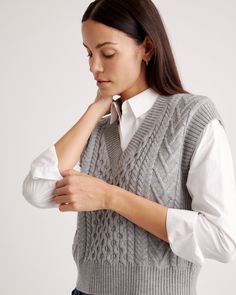 Stay cozy in our Australian Merino Wool Cable Sweater Vest. It's got the soft, smooth, temperature-regulating warmth you love in a soft, chunky cable knit. Makes a classic statement on its own, and wears just as well layered over a crisp white button down.  | Quince | Women's Australian Merino Wool Cable Sweater Vest in Heather Grey, Size XS Winter Cable Knit Sweater Vest, Cozy Sweater Vest For Winter Workwear, Winter Cable Knit Tops For Layering, Knit Sweater Vest For Winter, Fall Layering Pointelle Knit Sweater Vest, Solid Knit Sweater Vest For Winter, Cable Knit Tops For Winter Layering, Cozy Cable Knit Sweater Vest For Fall, Cozy Textured Knit Sweater Vest For Fall