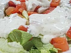 a salad with dressing and lettuce on it