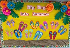 a bulletin board with flip flops and flowers on it