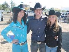 three people in cowboy hats posing for a photo