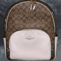 Coach Brown & White Backpack Big Enough To Fit Binder Gold Detailing Double Zipper Bag Zipper Pouch In Front Zipper Pouch Inside 2 Pockets Inside Drink Holder On Each Side If You Have Questions Please Ask Can Bundle White Luxury Backpack With Removable Pouch, Luxury White Backpack With Removable Pouch, Designer Beige Backpack For Everyday Use, Luxury Beige Backpack For Errands, White Coach Backpack For Everyday Use, White Coach Backpack For Travel, Luxury White Backpack With Detachable Strap, Elegant Coach Backpack For Daily Use, Everyday White Coach Backpack