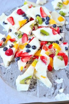 sliced fruit pizza sitting on top of a pan