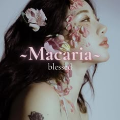 a woman with flowers on her face and the words macara written above her head