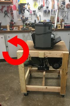 a workbench with tools on it and an arrow pointing to the toolbox