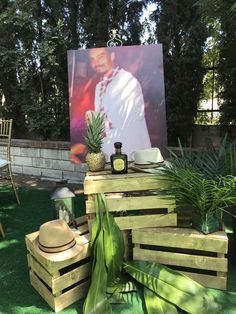 a table made out of wooden pallets with a photo on the wall behind it