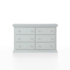 a white dresser sitting on top of a white floor