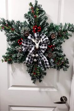 a christmas wreath hanging on the front door