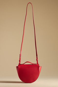 This one is a keeper: Elodie by Clare V. is the perfect size for carrying the essentials, featuring a top handle and removable crossbody strap. | Elodie Crossbody Bag by Clare V. in Red, Women's, Leather at Anthropologie Claire V Bags, Modern Red Satchel With Top Carry Handle, Luxury Red Bags With Adjustable Handle, Modern Red Top Handle Satchel, Modern Red Crossbody Bag, Red Leather Shoulder Bag With Adjustable Handle, Red Top Handle Shoulder Bag With Removable Pouch, Versatile Red Bag With Detachable Handle, Modern Red Shoulder Bag With Detachable Strap