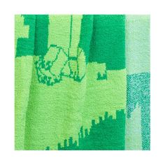 a green towel with an image of a cat on it