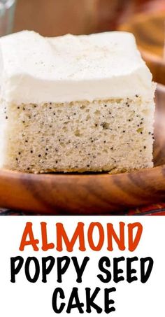 a close up of a piece of cake on a plate with the words almond poppy seed cake