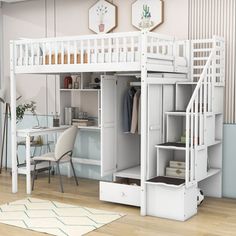 a white loft bed with stairs and desk underneath