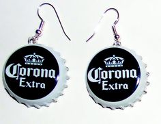 two bottle caps with the word corona on them are hanging from silver earwires