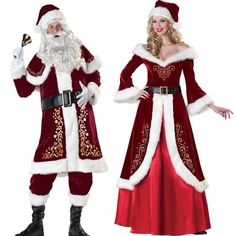 two people dressed up as santa claus and mrs claus, one holding a bell while the other is pointing