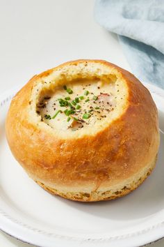 a white plate topped with a bread bowl