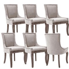 six upholstered dining chairs with nail polishing on the legs and backrests