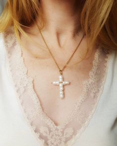 "Modern beaded cross necklace with fresh natural cultured pearls { D e s c r i p t i o n } With a modern design, this pearl cross pendant is a contemporary religious jewellery.  The shape is stunning, as each pearl has its own organic shape, making it unique. It hangs from a gold plated chain.  ** Available in silver design too: https://etsy.me/2Fz20Oi { S i z e } cross pendant: 1.8\" / 4.5 cm Chain - 18\"/ 45cm - adjustable length +/-2\" extension chain Here you can see my other necklaces: http White Cross Pearl Pendant Necklace, Pearl Crucifix Necklace As Gift, White Cross-shaped Pearl Pendant Necklace, Pearl Cross Necklace With Pearl Drop As Gift, Pearl Crucifix Necklace For Gift, Crucifix Pearl Necklace Gift, White Cross-shaped Pearl Necklace With Pendant, White Pearl Cross Pendant Necklace, White Pearl Cross Necklace