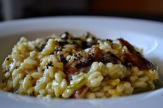 a white plate topped with rice and meat