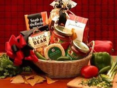 a basket filled with lots of food sitting on top of a table