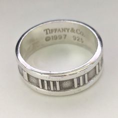 Good Condition With Light Wear/Scratches. Measures .25" Wide. Marked On Inner Shank, "Tiffany & Co. C1997 925". Ring Will Come With An Non-Designated Box. Item#10107 Roman Numeral Ring, Roman Numerals, Tiffany & Co., Womens Jewelry Rings, Ring Size, 925 Sterling Silver, Women Jewelry, Sterling Silver, Silver