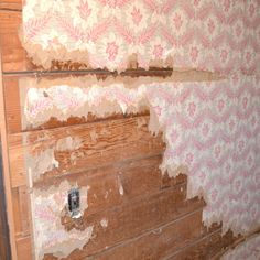 peeling paint on the wall and wood paneling in an old house that needs to be remodeled