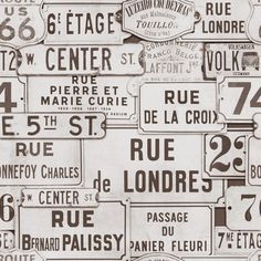 many different street signs are grouped together in this black and white photo with brown accents