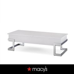 a white coffee table sitting on top of a black and white background with the words macy's above it