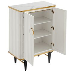 a white cabinet with gold trim and drawers