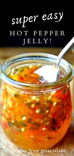 a jar filled with hot pepper jelly on top of a table