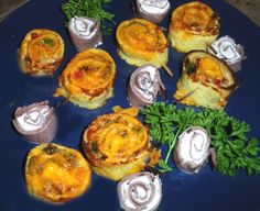 there are many small appetizers on the plate with toothpicks and parsley