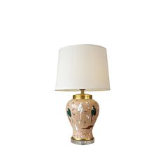 a table lamp with a white shade on it's base and an animal print design